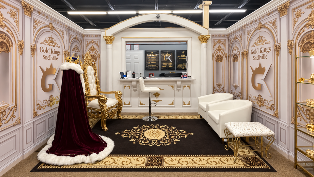 Gold Kings of Snellville showroom with a gold throne, burgundy robe, customer seating and service counter
